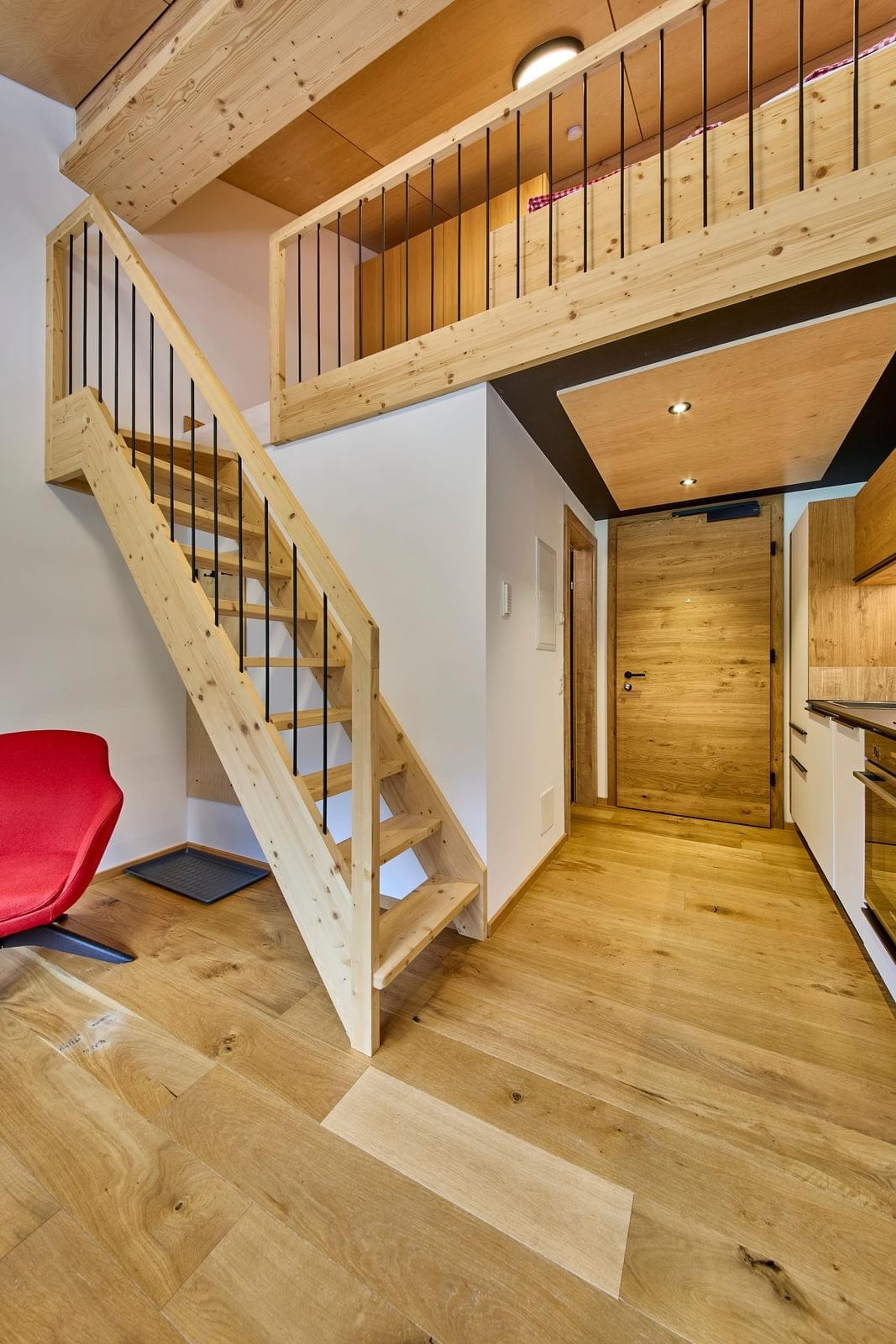 Bocks Apartments 53C - Top 3 Birke - Open dishwasher showing the racks for loading dishes. Located in a modern kitchen setting.